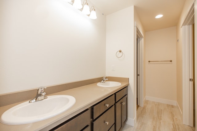 bathroom featuring hardwood / wood-style flooring and vanity