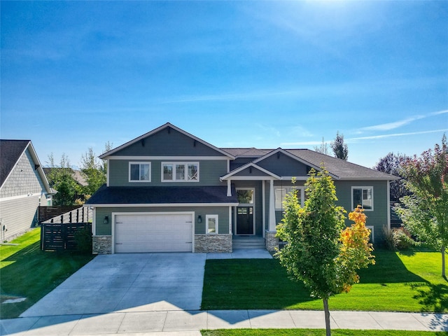 view of front of home featuring a front lawn and a garage