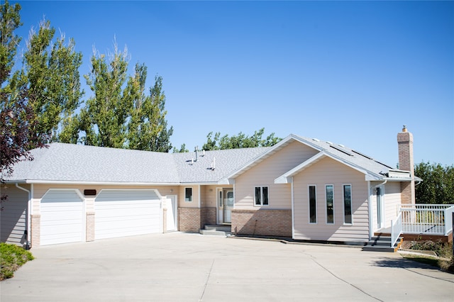 ranch-style home featuring a garage