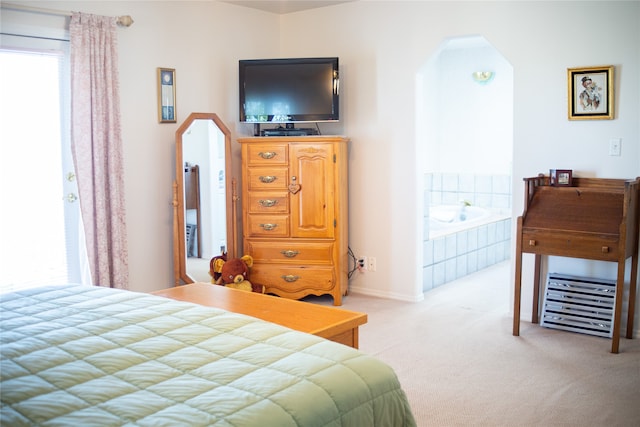 bedroom featuring light colored carpet