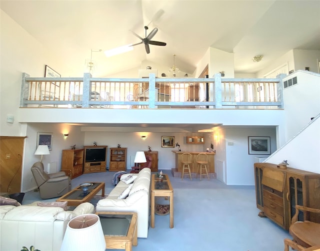 living room with high vaulted ceiling, carpet, and ceiling fan