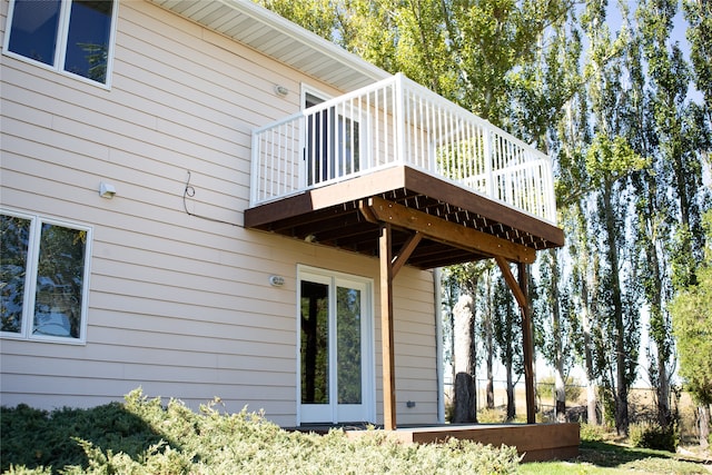 view of side of property featuring a wooden deck