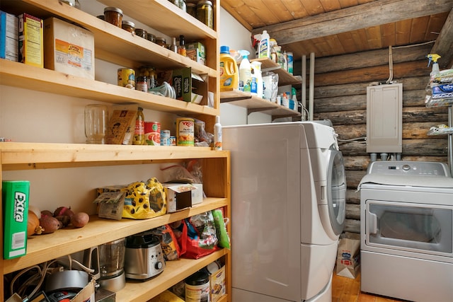 washroom with wood ceiling, hardwood / wood-style flooring, log walls, and washing machine and dryer