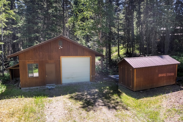 garage featuring wooden walls