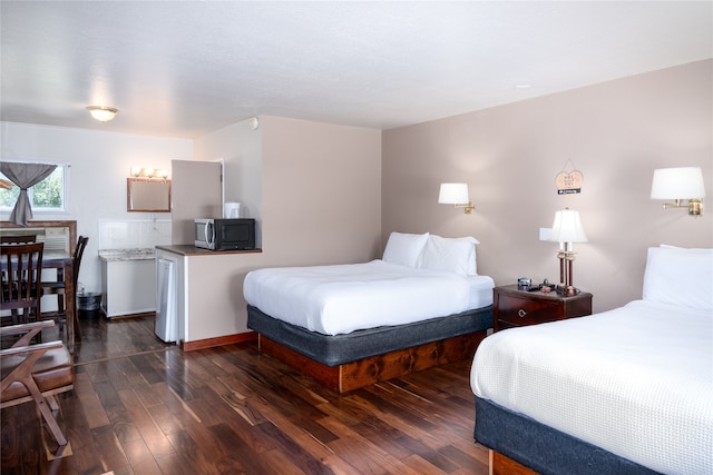 bedroom featuring dark hardwood / wood-style flooring