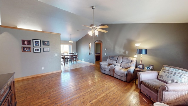 living room featuring lofted ceiling, ceiling fan, and hardwood / wood-style floors