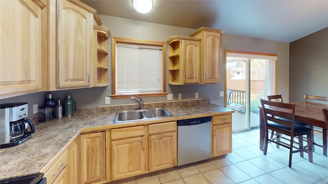 kitchen with light brown cabinets, light tile patterned floors, sink, stainless steel dishwasher, and black stove