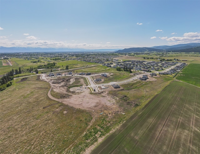 drone / aerial view with a mountain view and a rural view