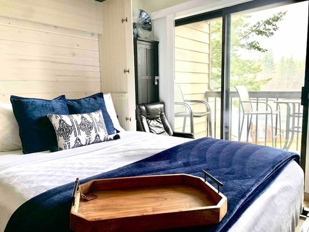 bedroom with wood walls