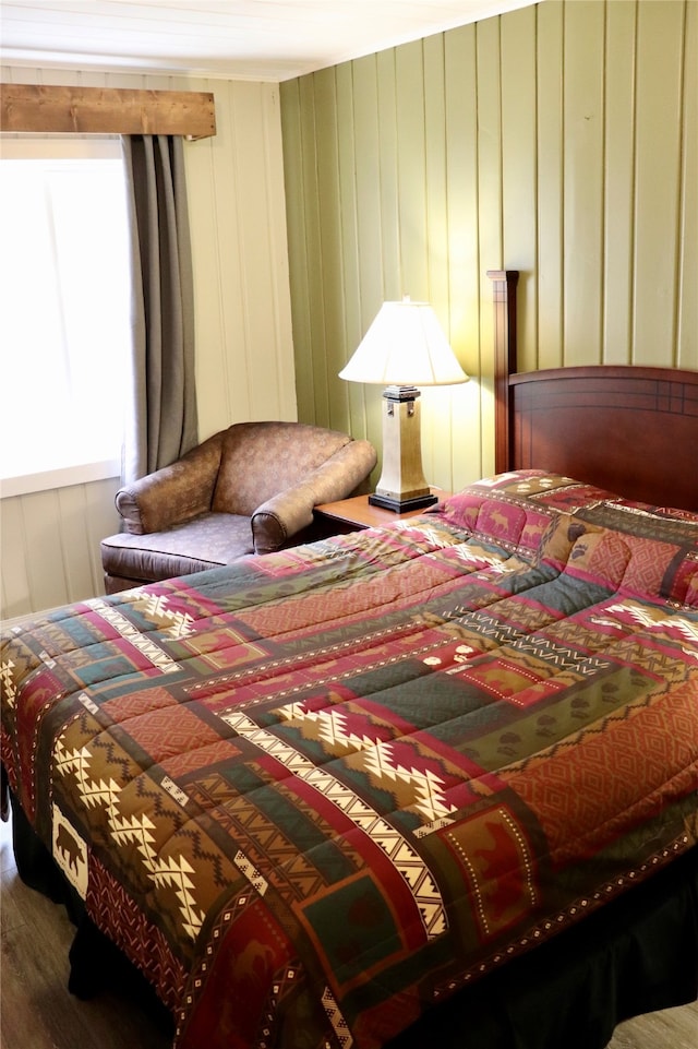 bedroom with hardwood / wood-style floors