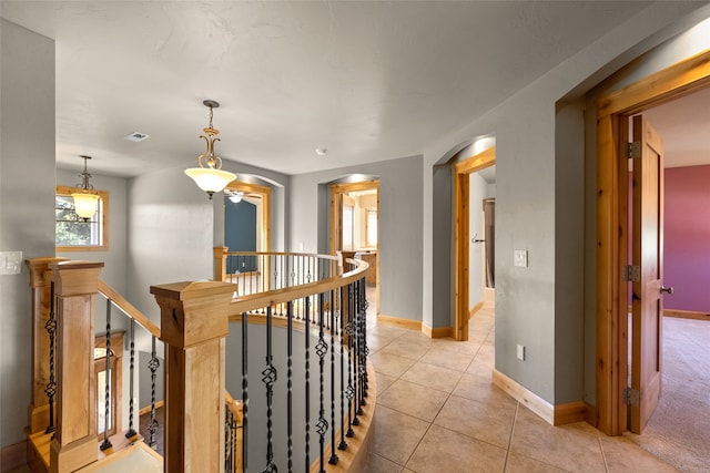 hallway with light tile patterned floors