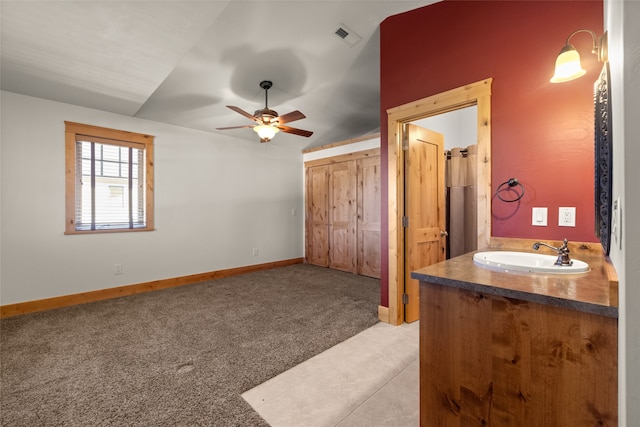 bathroom with vanity, vaulted ceiling, and ceiling fan