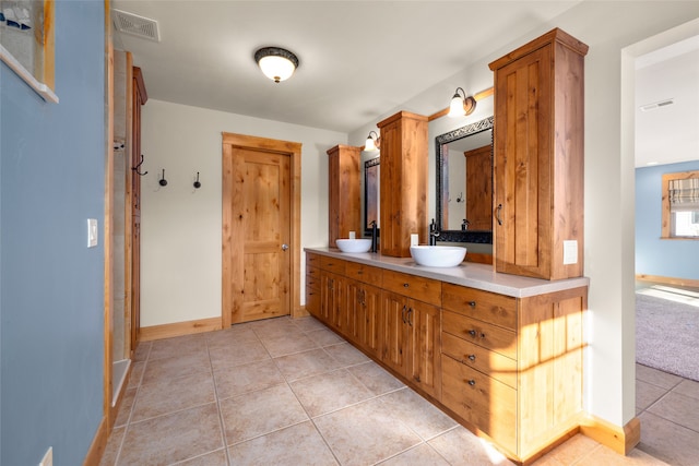 bathroom with vanity and tile patterned floors