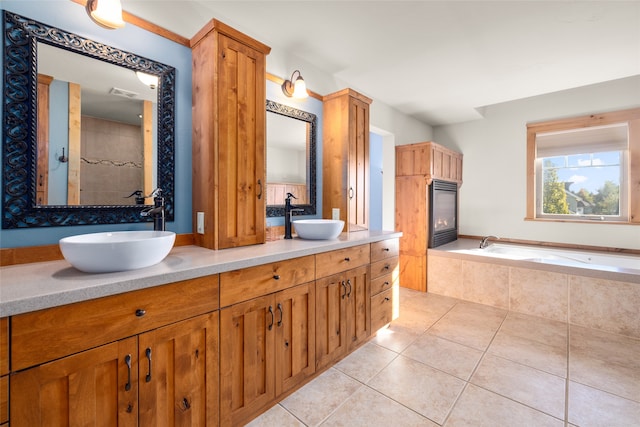 bathroom with vanity, plus walk in shower, and tile patterned floors