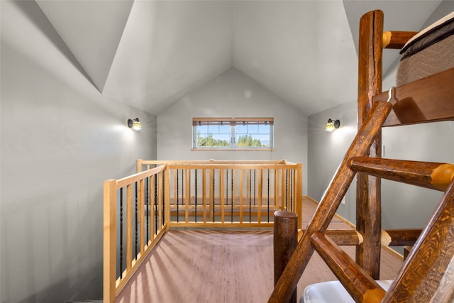 stairs with carpet and lofted ceiling