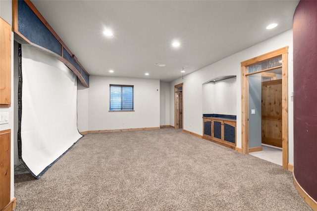 basement featuring carpet flooring