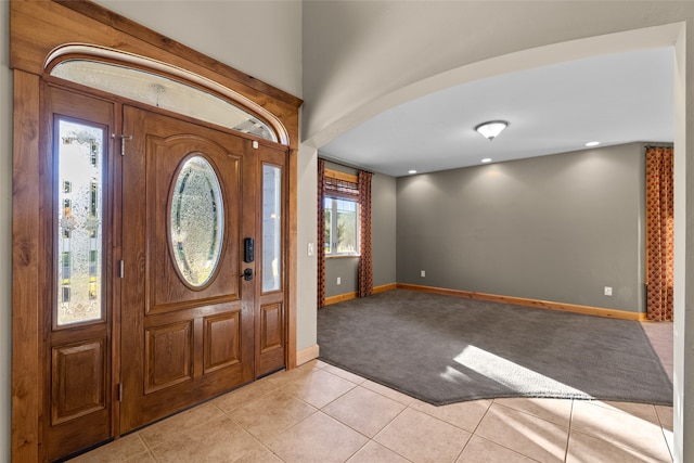 tiled foyer with plenty of natural light