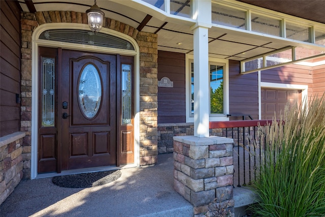 entrance to property with a porch