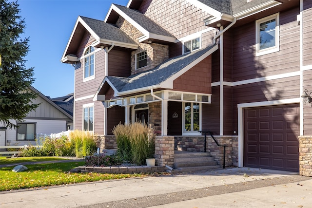 craftsman-style home with a garage