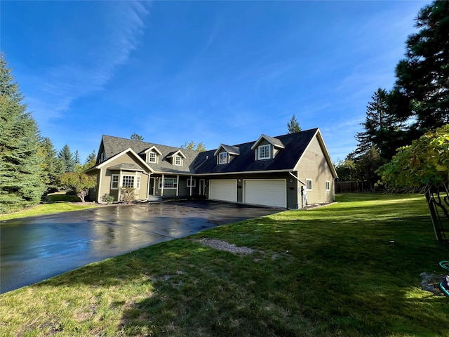 cape cod home with a garage and a front yard