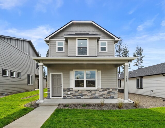 view of front of property with a patio area and a front yard