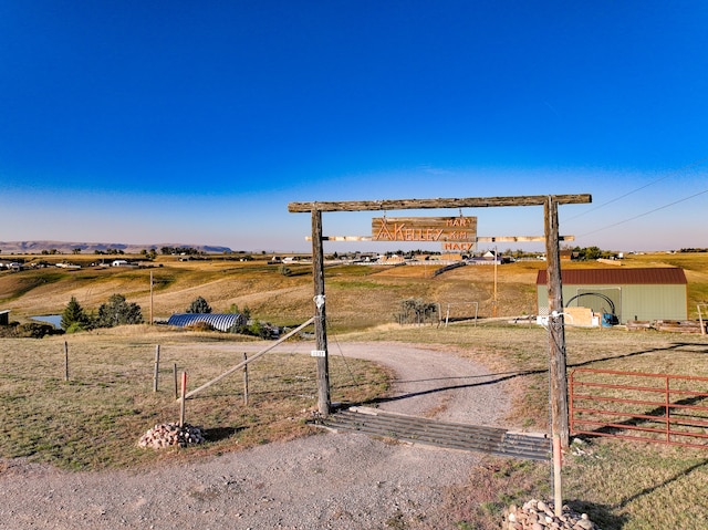 view of yard with a rural view