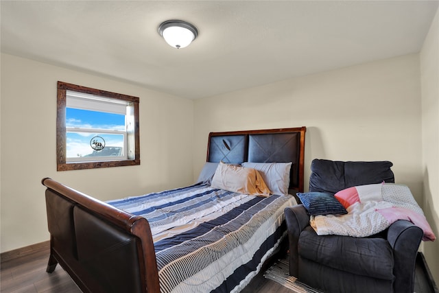 bedroom with hardwood / wood-style floors