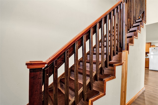 staircase featuring hardwood / wood-style flooring