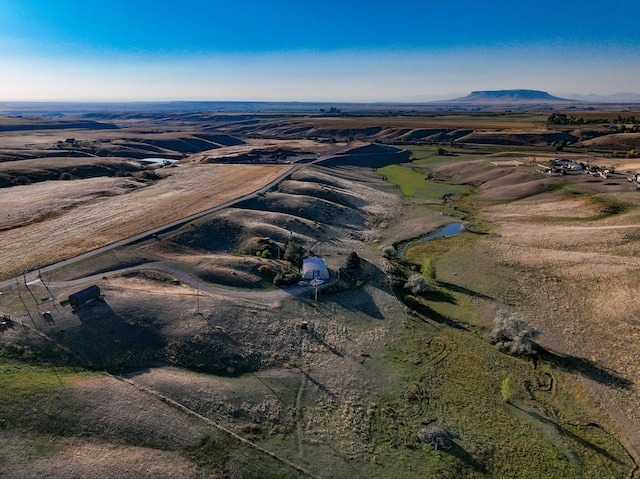 aerial view with a mountain view and a rural view