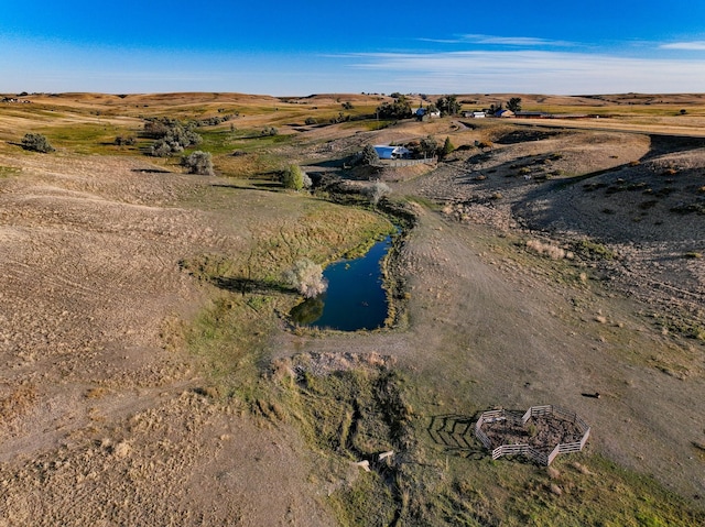 aerial view featuring a rural view and a water view