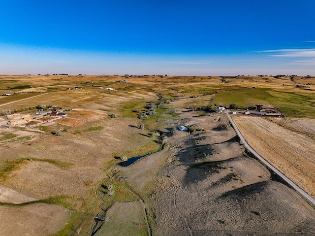 birds eye view of property featuring a rural view