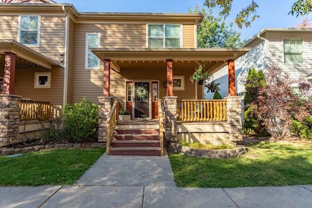 view of front of house featuring a front yard and a porch