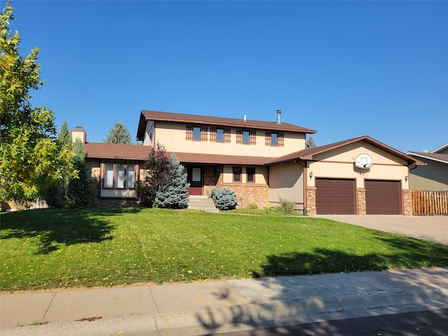 view of front facade with a front yard and a garage