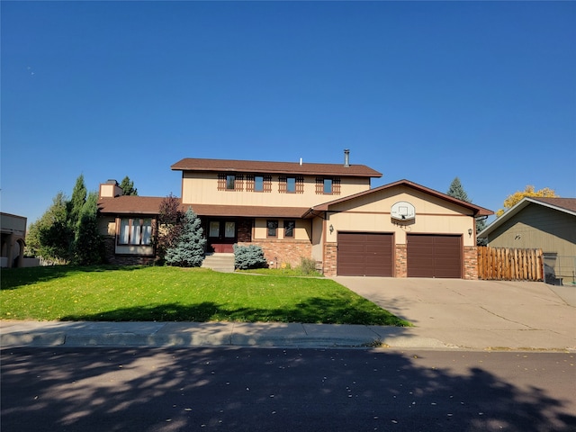 view of front of home with a garage and a front yard