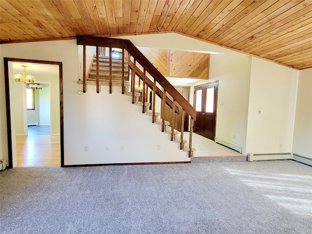 interior space featuring lofted ceiling, light colored carpet, wood ceiling, and baseboard heating