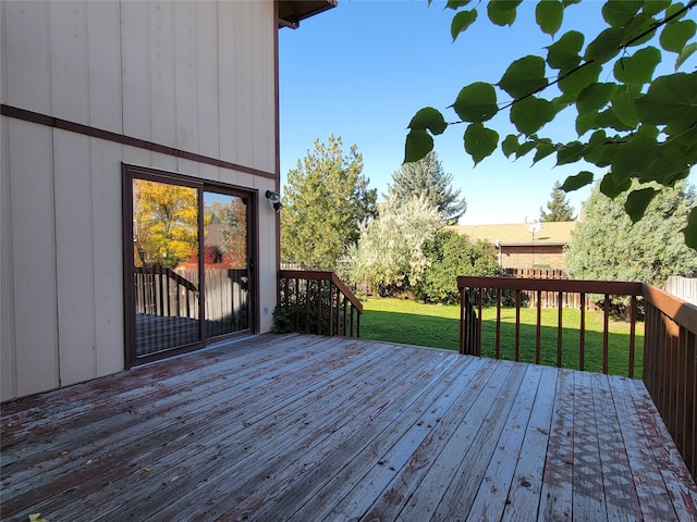 wooden deck with a yard