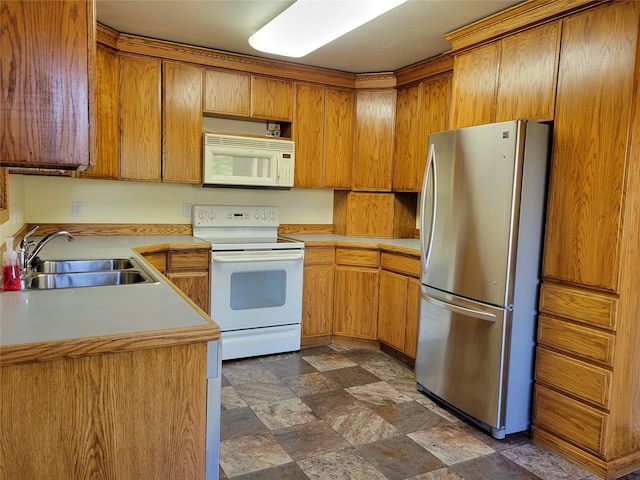 kitchen with sink and white appliances