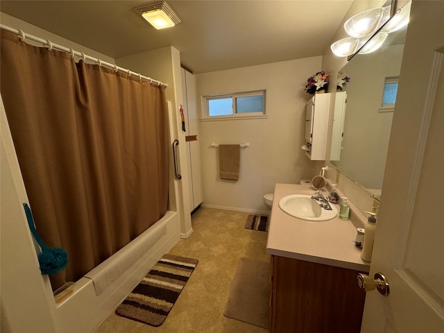 full bathroom with toilet, shower / bath combo with shower curtain, and vanity