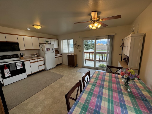 608 Clark St, Deer Lodge, MT 59722 - dining area with light floors and a ceiling fan