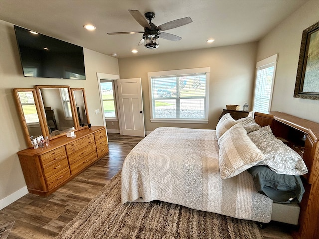 bedroom featuring ceiling fan and dark wood-type flooring