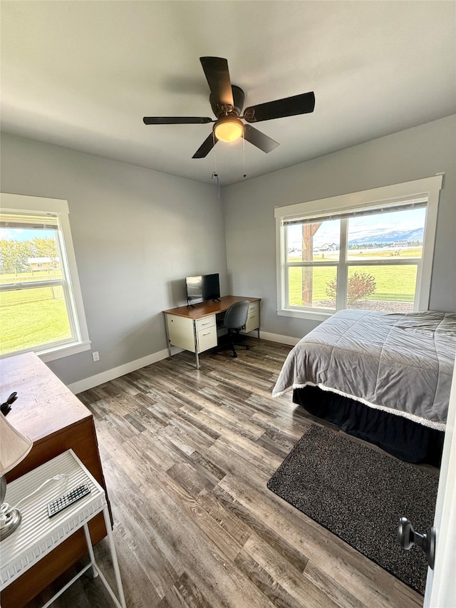 bedroom featuring wood-type flooring and ceiling fan