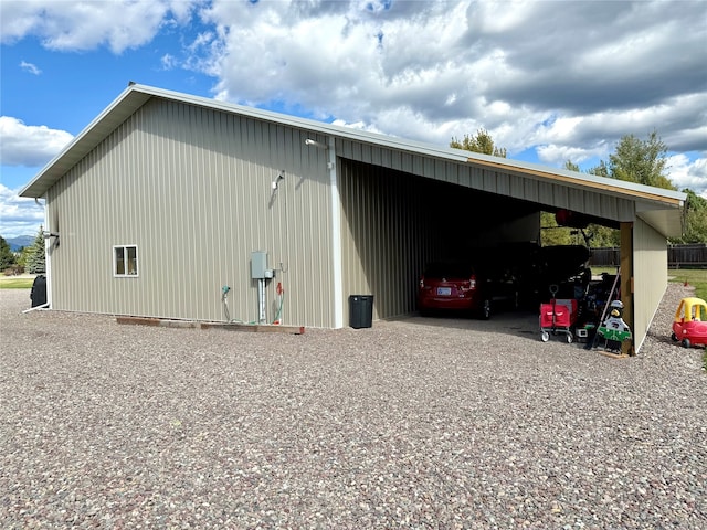 view of outbuilding featuring a carport