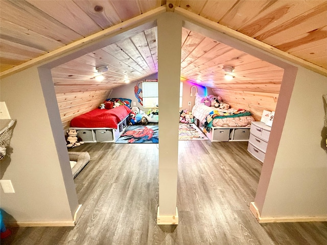 bedroom featuring wood ceiling, hardwood / wood-style floors, and vaulted ceiling