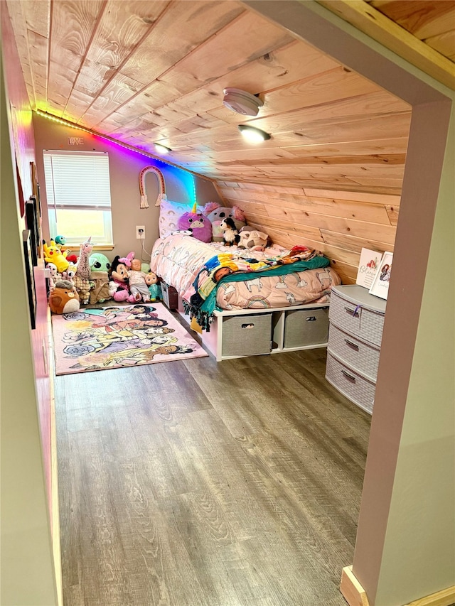 bedroom with wood-type flooring, vaulted ceiling, and wood ceiling