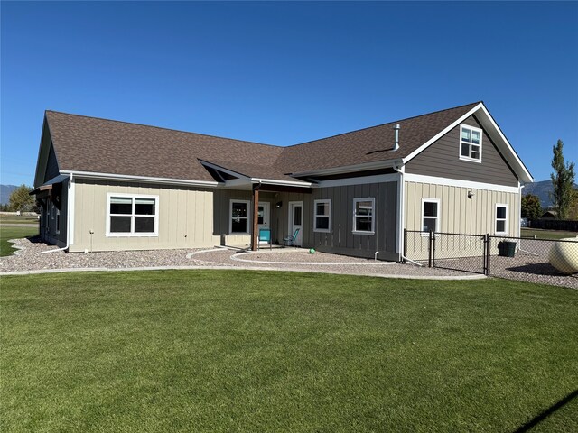 back of house featuring a yard and a patio area