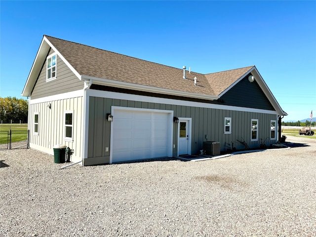 view of home's exterior featuring central AC and a garage