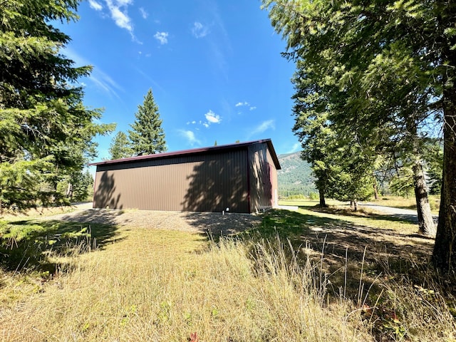 view of side of property featuring an outdoor structure