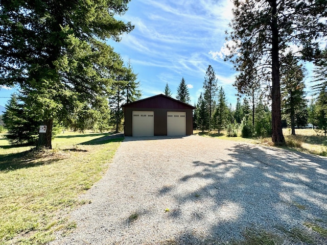 garage featuring a yard