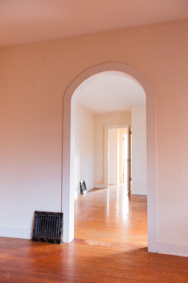 hall with wood-type flooring