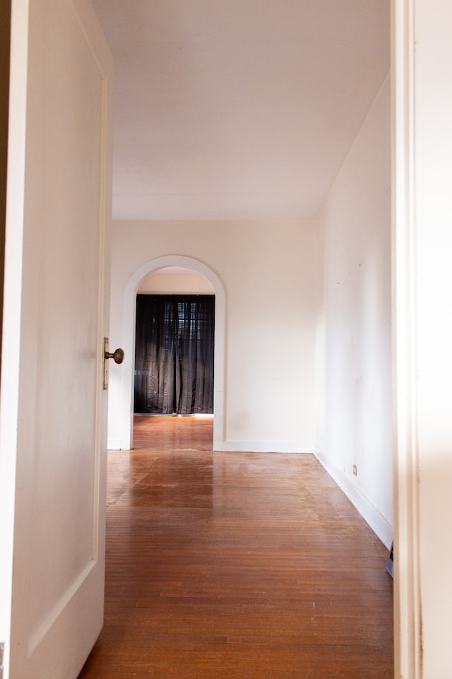 corridor with wood-type flooring